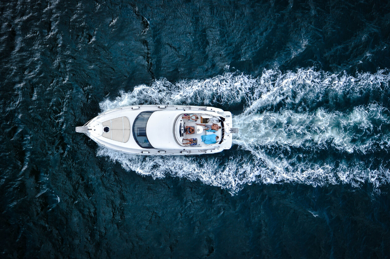 Top-down view of a luxury motor yacht cruising the open Mediterranean, featured by Serghi Yachting – boutique yacht brokerage.